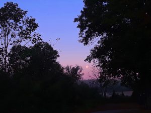 October's super moon sets over the West Chickamauga Creek