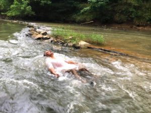 Enjoying the bubbling rapids of a West Chickamaua Creek fishing weir: Negative Ions bring health benefits, grounding and peace