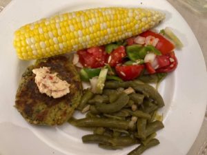zucchini basil latkes, fresh corn, tomato cucumber salad, green beans